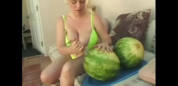  Kinky dude and blonde with huge tits get playful with a water melon then fuck outdoors